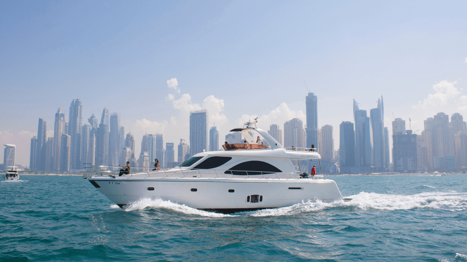 A speed boat cruising in Dubai marina on a sunny day.